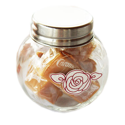 Mini Glass Jars filled with caramels and decorated with a flower sticker (caramels and sticker not included.).